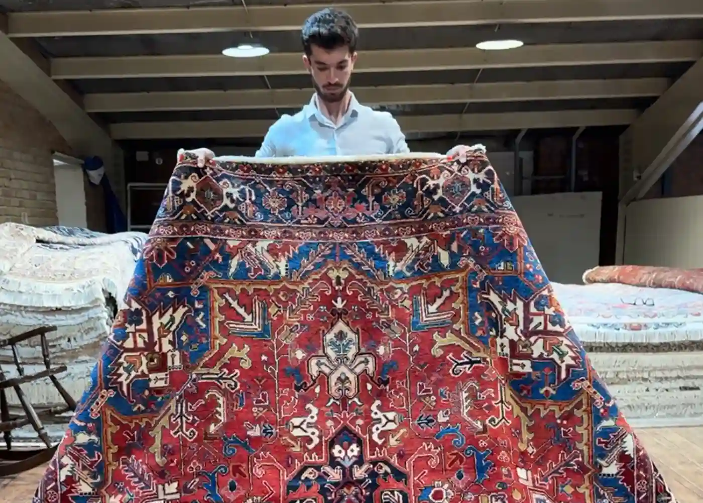Old handmade Persian rug showing age and natural patina
